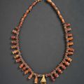 An Antique bronze and cornelian necklace, circa early 1st millennium