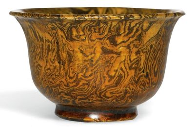 An amber-glazed marbled pottery cup, Tang dynasty (618-907)