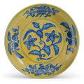 A rare yellow-ground blue and white 'gardenia' dish, Zhengde six-character mark and of the period (1506-1521)