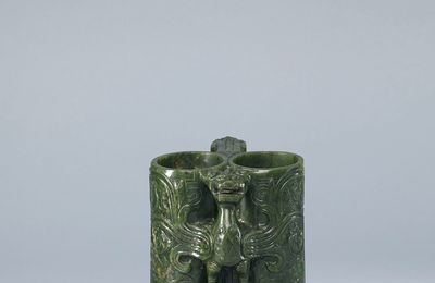A carved spinach-green jade 'champion vase', the vase Ming dynasty (1368-1644), with a Qianlong incised mark and period