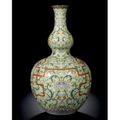 A magnificent yellow-ground famille-rose double-gourd vase. Seal mark and period of Qianlong