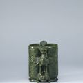 A carved spinach-green jade 'champion vase', the vase Ming dynasty (1368-1644), with a Qianlong incised mark and period