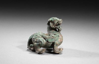 An archaic bronze ‘mythical beast’ paperweight, Eastern Han dynasty