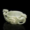 A pale green jade chilong-handled cup, 17th century