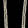 A two-strand natural pearl and diamond necklace 