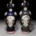 A massive pair of famille rose powder-blue-ground baluster vases and cover. Qianlong/Jiaqing