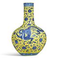 A fine and magnificent lemon-yellow and underglaze-blue ‘Dragon’ vase, tianqiuping, seal mark and period of Qianlong (1736-1795)