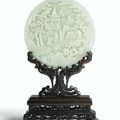 A finely carved white jade circular table screen, Qing dynasty, Qianlong period (1736-1795)