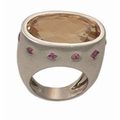 ESCHER; Importante bague en or gris sertie d'une citrine rosée et couronnée de tourmalines.