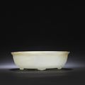 A white and russet jade 'Twin-fish and Bajixiang' 'marriage' bowl, Qianlong period (1736-1795)