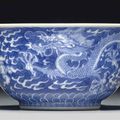 A small blue and white 'dragon' bowl, Qianlong seal mark in underglaze blue and of the period (1736-1795)