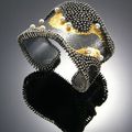 Sonata in the Rain” bracelet of oxidized silver, 24k gold leaf, pearls by So Young Park.