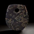 A dark blackish-grey stone axe, Neolithic period, Liangzhu culture, 4th-3rd millenium BC