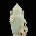A pale celadon jade 'bird' vase and cover, Qing dynasty, 18th-19h century