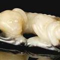 A creamy-white and black jade dog. Song-Ming dynasty (960-1644) 