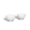 A pair of fine white glazed porcelain cups, 18th century