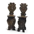 Two Italian carved walnut sgabelli, possibly Tuscan, 16th/ 17th century 