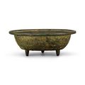 An inscribed bronze 'dragon and phoenix' washer, Yuan dynasty (1279-1368)