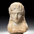 A Roman marble female portrait bust. North Africa, circa 2nd Century A.D.