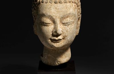 A small limestone head of Buddha, Northern Qi-Sui dynasty, 6th century