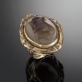An engaging 14K gold cameo ring with a carved agate portrait of King Arthur. Circa 1900.