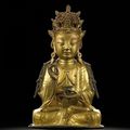 A gilt-bronze seated figure of Guanyin, Ming dynasty, 16th century