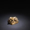 A rare gilt-bronze 'toad' weight, Han Dynasty (206 BC - 220 AD)