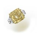 A fancy colored diamond and diamond ring