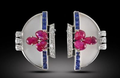 Pair of Art Deco carved ruby, frosted rock crystal and sapphire clips by Oscar Heyman, New York