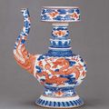 A fine and extremely rare underglaze-blue and iron-red-decorated Tibetan-style ewer, Qianlong sealmark and of the period