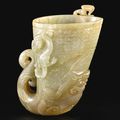 A celadon and russet jade archaistic rhyton, Ming dynasty (1368–1644)