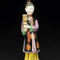 A rare gilt and polychrome enameled export porcelain figure of a female attendant. Qianlong Period 