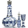 A Transitional blue and white silver-mounted bottle vase, a blue and white stemcup and a silver-mounted jarlet. Mid 17th Century