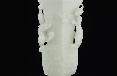 A finely carved white jade archaistic vase, Qing dynasty, 18th century