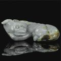 A large jade carving of a recumbent mythical beast. 17th century