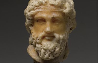 A Bi-colored Marble Head of Dionysos, Roman Imperial, circa late 1st Century A.D.