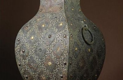 A rare copper-inlaid archaic bronze wine vessel with gilt bosses, fanghu, Warring States period, 4th century BC