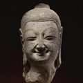 An exceptional sandstone head of Buddha, Northern Wei dynasty, Yungang Caves, late 5th Century