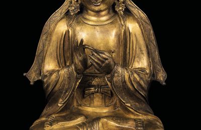 A gilt bronze figure of Vairocana, China, Ming Dynasty, 16th century