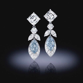  An important pair of fancy colored diamond and diamond earrings 