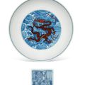 An iron-red-decorated blue and white 'dragon' dish, Qianlong six-character seal mark in underglaze blue and of the period (1736-