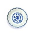 A miniature blue and white lobed 'floral' medicine dish, Mark and period of Jiajing (1522-1566)