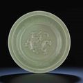 A Longquan celadon carved and moulded 'Dragon' dish, Late Yuan-Early Ming dynasty, 14th century
