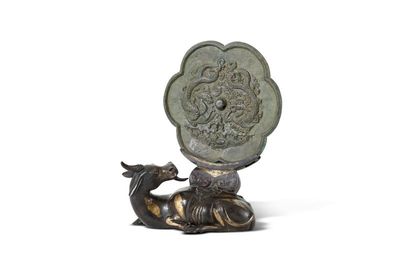 A bronze 'twin dragon' mirror, Song dynasty, and a parcel-gilt bronze mirror stand, Ming dynasty