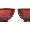 A pair of Chinese red glass 'Immortals' bowls, 19th-20th century