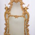 A pair of shaped borderglass giltwood mirrors in the manner of Matthias Lock