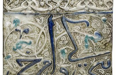 An Ilkhanid lustre, cobalt-blue and turquoise moulded pottery tile, Iran, late 13th-early 14th century