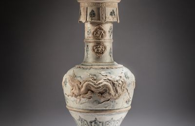 An important blue and white appliqué-decorated 'dragon' lamp stand, Vietnam, Lê dynasty, dated to the second year of Vĩnh Trị, corresponding to 1677