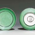 A pair of mint-green-glazed 'dragon' dishes, black enamel Kangxi six-character marks within double circles and of the period