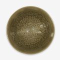A Chinese 'Yaozhou' celadon glazed 'boys' tea bowl, Northern Song dynasty (960–1127)
